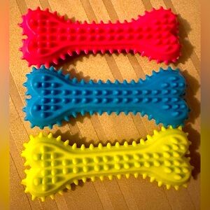 NWT untitled rubber toys in yellow, blue and red approximately 4” long
